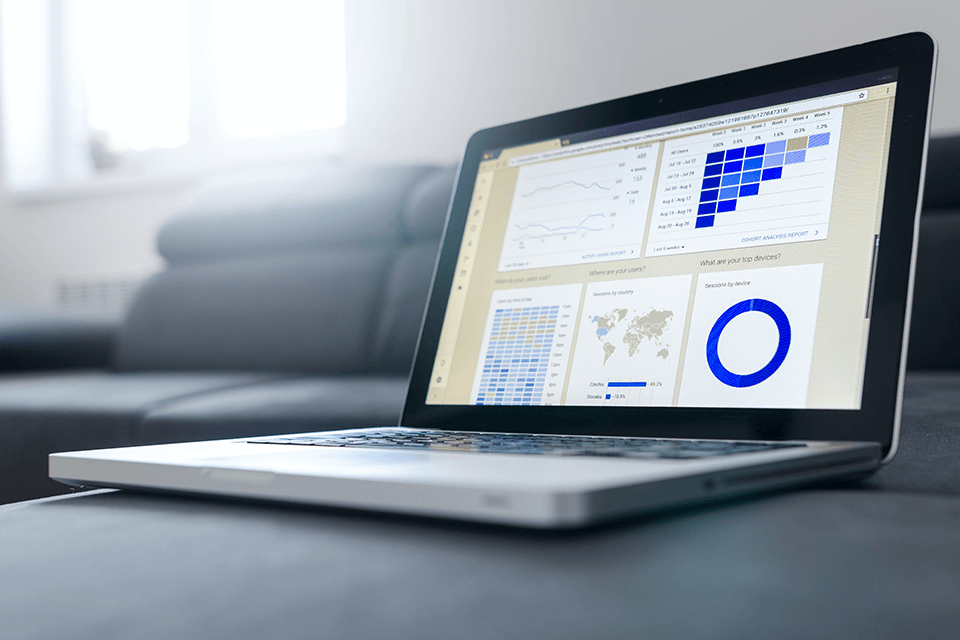Laptop with charts on the screen